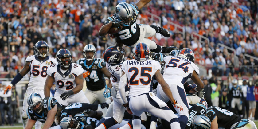 Carolina Panthers' Jonathan Stewart (28) leaps over the goal line to score a touchdown against the Denver Broncos during the NFL's Super Bowl 50 football game in Santa Clara, California California February 7, 2016. REUTERS/Stephen Lam (TPX IMAGES OF THE DAY)